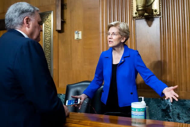 Rettig greets Sen. Elizabeth Warren (D-Mass.) before testifying during a June 8 Senate hearing on the IRS's 2022 budget request. (Photo: Tom Williams via Getty Images)