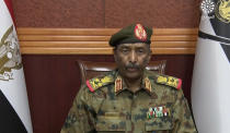 In this frame taken from video, the head of the military, Gen. Abdel-Fattah Burhan, announced in a televised address, that he was dissolving the country's ruling Sovereign Council, as well as the government led by Prime Minister Abdalla Hamdok, in Khartoum, Sudan, Monday, Oct. 25, 2021. Burhan said the military will run the country until elections in 2023. His announcement came hours after his forces arrested the acting prime minister and other senior government officials. (Sudan TV via AP)