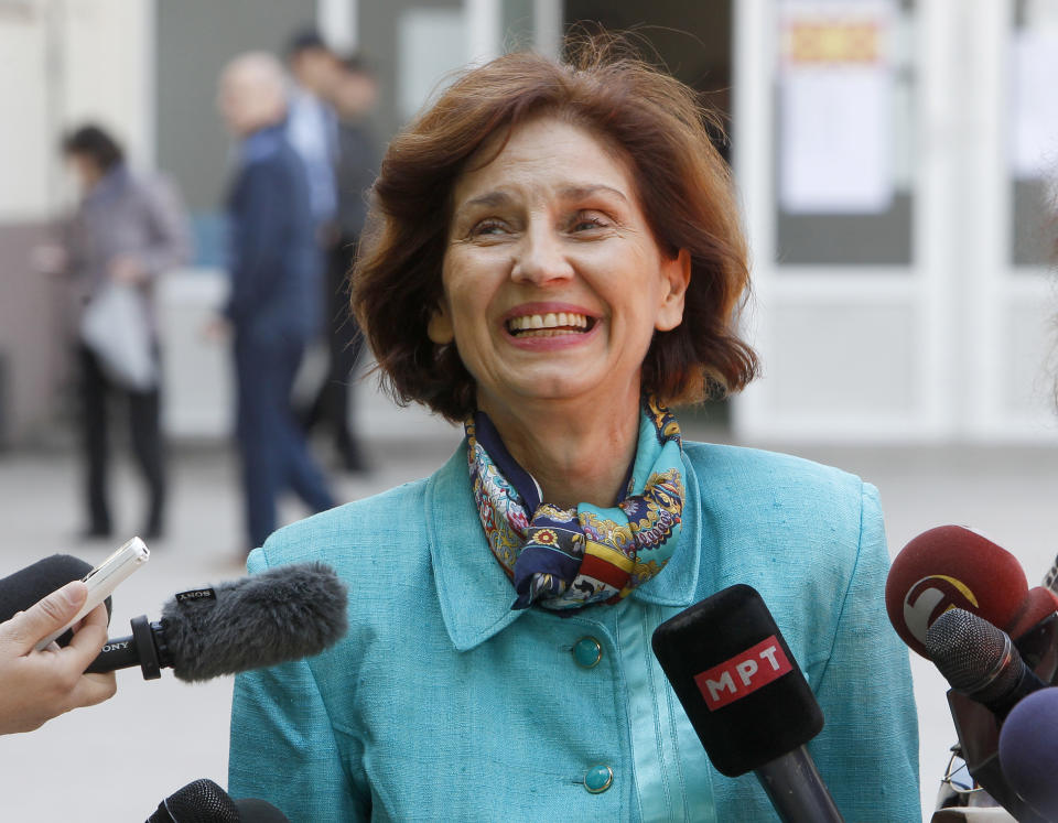 Gordana Siljanovska Davkova, a presidential candidate for the opposition conservative VMRO-DPMNE party, talks for the media outside a polling station, after voting for the presidential elections, in Skopje, North Macedonia, Sunday, April 21, 2019. North Macedonia holds the first round of presidential elections on Sunday, seen as key test of the government following deep polarization after the country changed its name to end a decades-old dispute with neighboring Greece over the use of the term "Macedonia". (AP Photo/Boris Grdanoski)