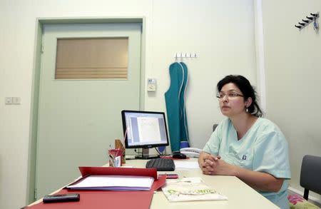 Dentist Niki Diamanti is seen in her office in the city of Ioannina, Greece July 10, 2015. Picture taken July 10, 2015. To match Special Report GREECE-TEETH/ REUTERS/Cathal McNaughton