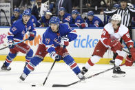 New York Rangers defenseman Tony DeAngelo (77) controls the puck as Detroit Red Wings left wing Tyler Bertuzzi (59) defends during the second period of an NHL hockey game Friday, Jan. 31, 2020, in New York. (AP Photo/Sarah Stier)