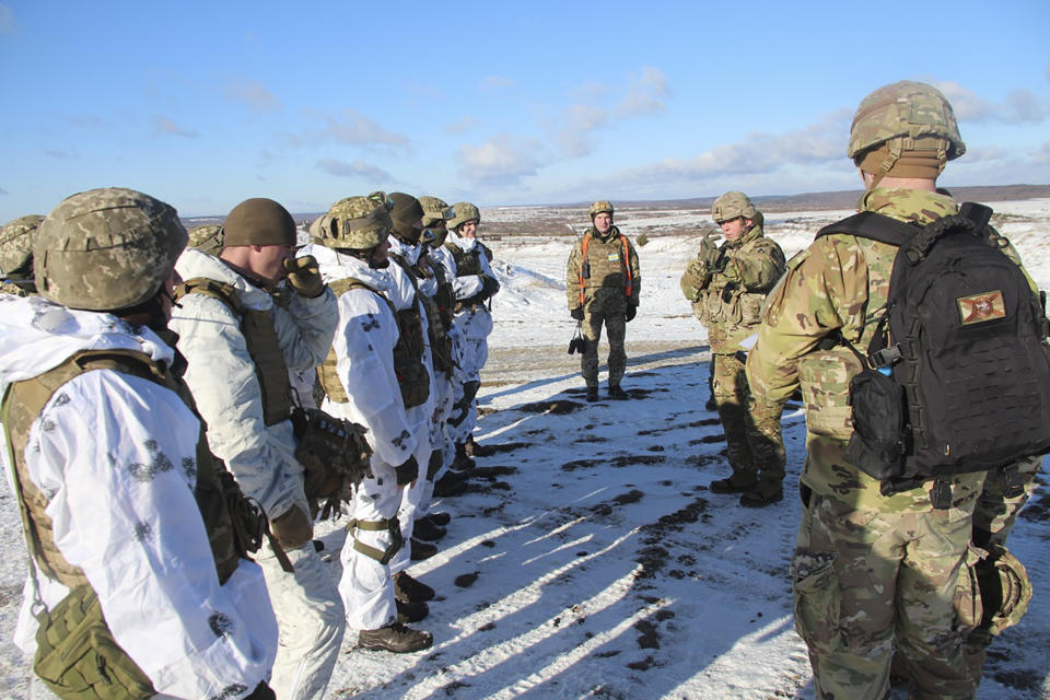 In this photo provided by the Ukrainian Defense Press Service and taken on Jan. 30, 2022, US instructors train Ukrainian soldiers for the use of M141 Bunker Defeat Munition (SMAW-D) missiles at the Yavoriv military training ground, close to Lviv, western Ukraine. (Ukrainian Defense Ministry Press Service via AP)