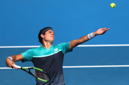 Tennis - Australian Open - Quarter-final - Melbourne Park, Melbourne, Australia, January 23, 2019. Canada's Milos Raonic serves to France's Lucas Pouille. REUTERS/Lucy Nicholson