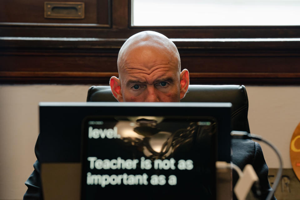 Fetterman reads closed captions on his device during a May 16 meeting<span class="copyright">Shuran Huang for TIME</span>