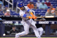 New York Mets' Javier Baez strikes out swinging during the first inning of a baseball game against the Miami Marlins, Thursday, Aug. 5, 2021, in Miami. (AP Photo/Lynne Sladky)