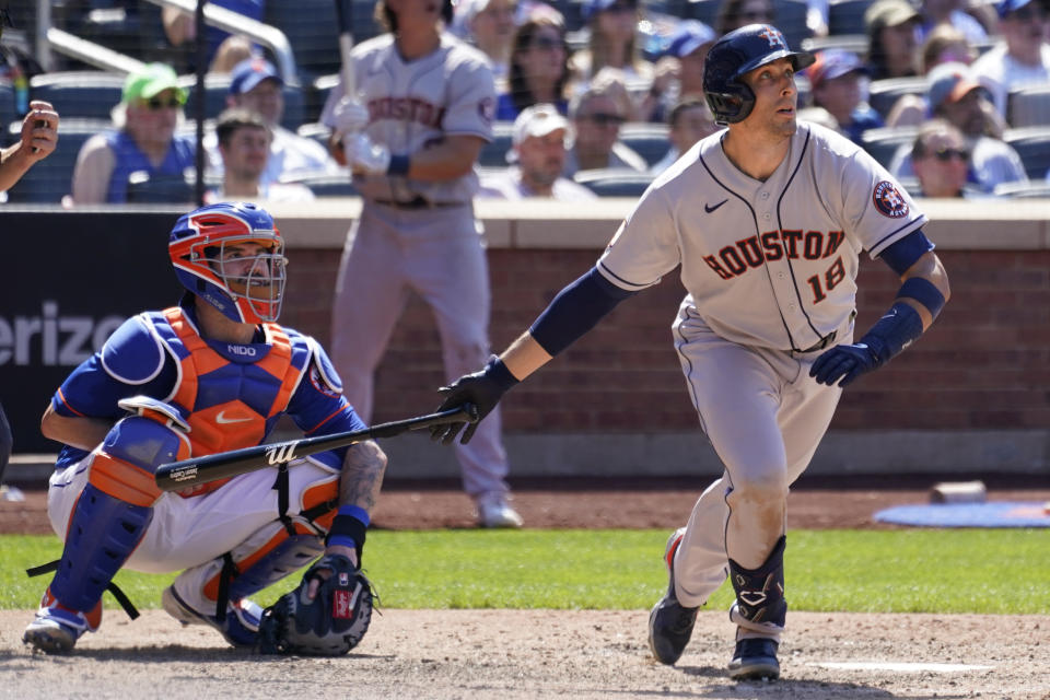 Houston Astros' Jason Castro watches the ball after hitting a two-run home run during the ninth inning of a baseball game against the New York Mets, Wednesday, June 29, 2022, in New York. The Astros won 2-0. (AP Photo/Mary Altaffer)