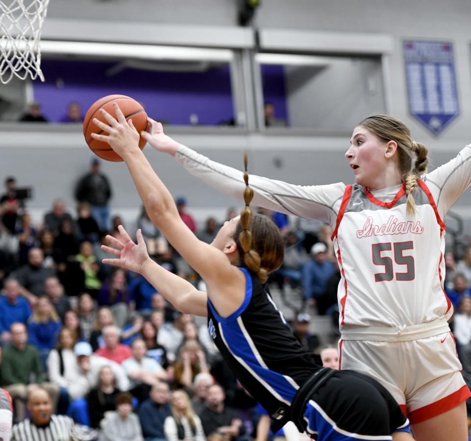 Northwest's Lily Bottomly tips the ball away from CVCA's Gia Casalinova in the second half of a regional semifinal at Barberton High School, Tuesday, Feb. 28, 2023.