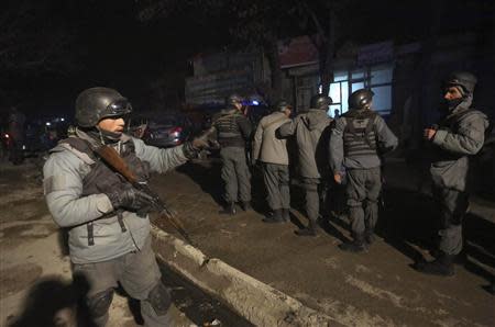 Afghan police officers arrive at the scene of an explosion in Kabul January 17, 2014. REUTERS/Omar Sobhani