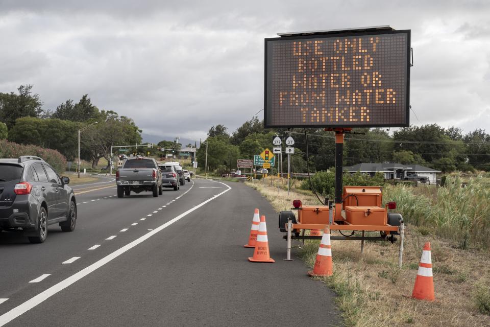A sign says to "Use only bottled water or from water tanker" on Wednesday, Sept. 27, 2023, in Kula, Hawaii. (AP Photo/Mengshin Lin)