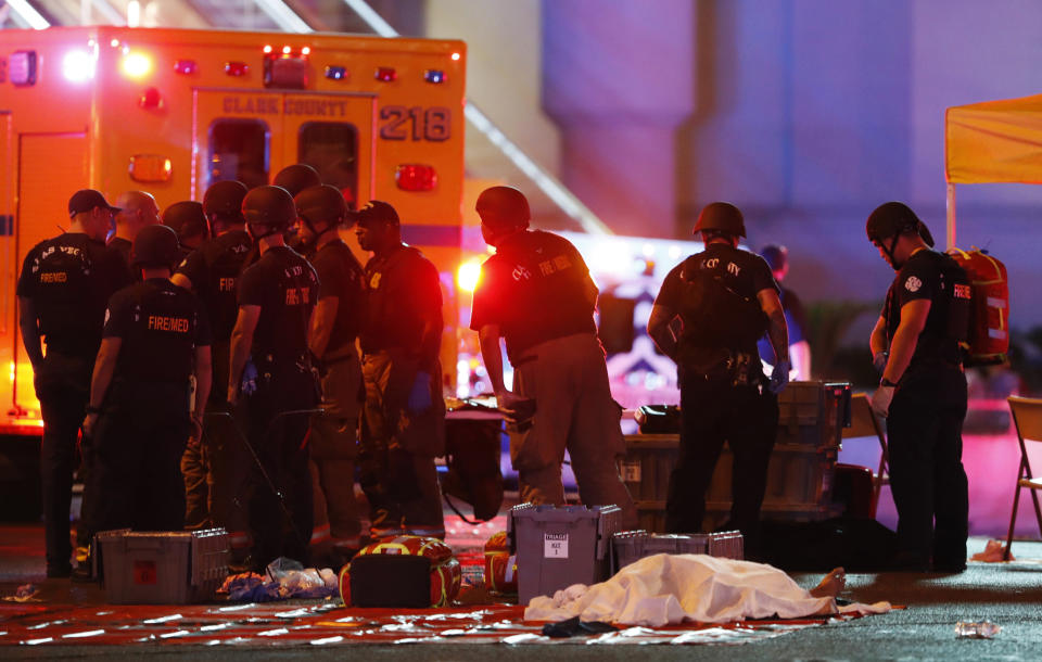 FILE - A body is covered with a sheet after a mass shooting in which dozens were killed at a music festival on the Las Vegas Strip on Sunday, Oct. 1, 2017. Five years after a gunman killed 58 people and wounded hundreds more at a country music festival in Las Vegas in the deadliest mass shooting in modern U.S. history, the massacre is now part of a horrifying increase in the number of mass slayings with more than 20 victims, according to a database of mass killings maintained by The Associated Press, USA Today and Northeastern University. (Steve Marcus/Las Vegas Sun via AP, File)