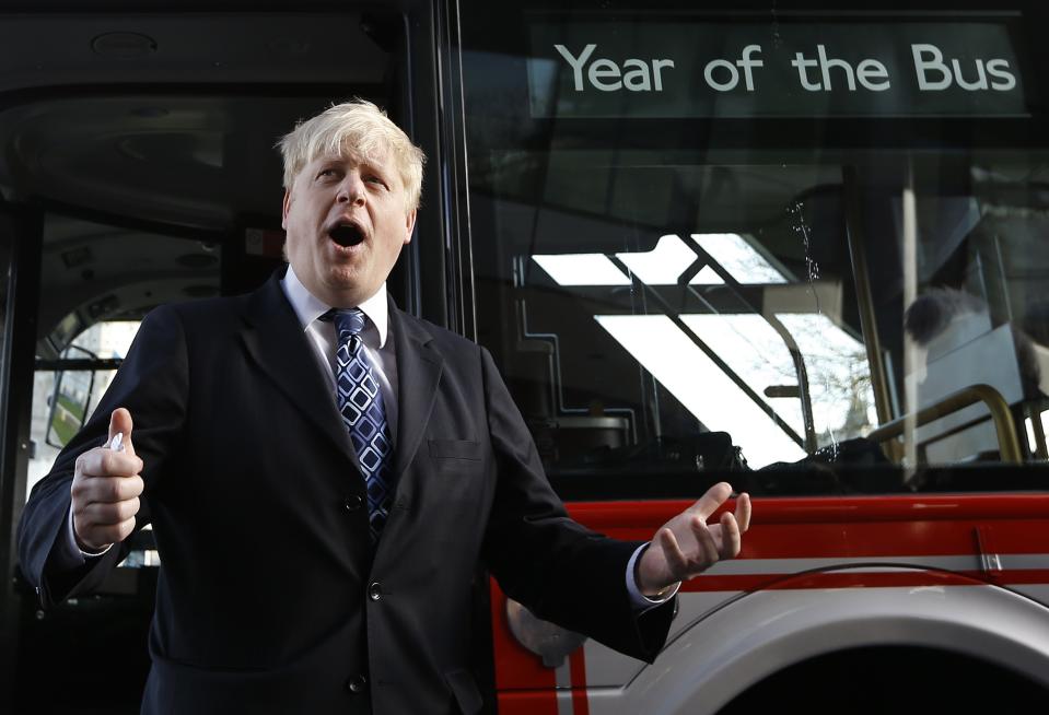 Boris Johnson the Mayor of London  stands in front of a routemaster bus to launch the Year of the Bus campaign, in London, Monday, Jan. 27, 2014. (AP Photo/Kirsty Wigglesworth)