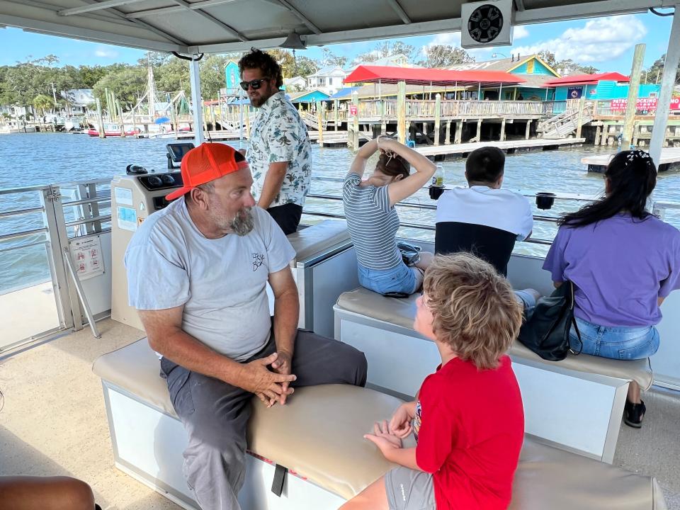 Southport native and local character Jody Wilmoth leads the second "Jody Tour" with Southport Water Tours as Captain Robert "Bobbo" Frankenfeld steers the boat on Sunday, September 25, 2022.