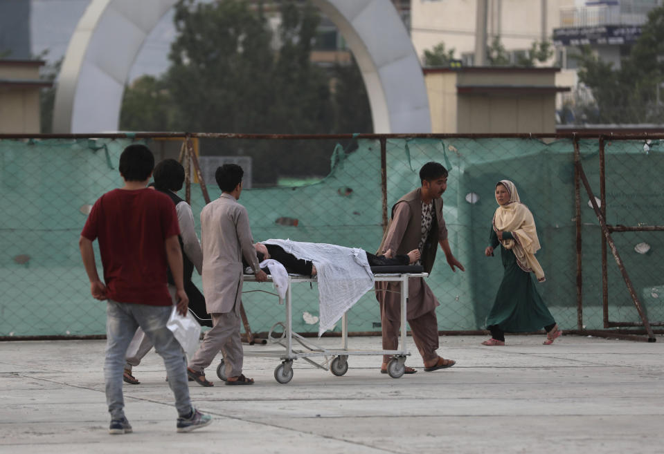 An injured school student is transported to a hospital after a bomb explosion near a school in west of Kabul, Afghanistan, Saturday, May 8, 2021. A bomb exploded near a school in west Kabul on Saturday, killing several, many them young students, Afghan government spokesmen said. (AP Photo/Rahmat Gul)