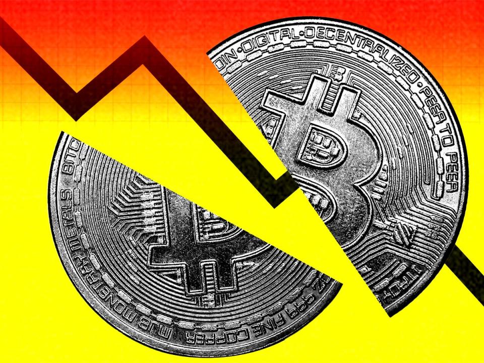 split bitcoin against red and yellow gradient background with trending line in between.