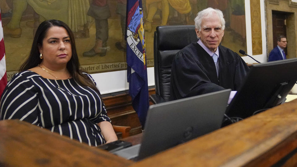 Judge Arthur Engoron, right, and principal law clerk Allison Greenfield sit on the bench in the courtroom before the start of a civil business fraud trial against the Trump Organization, Wednesday, Oct. 4, 2023, in New York. (AP Photo/Mary Altaffer, POOL)