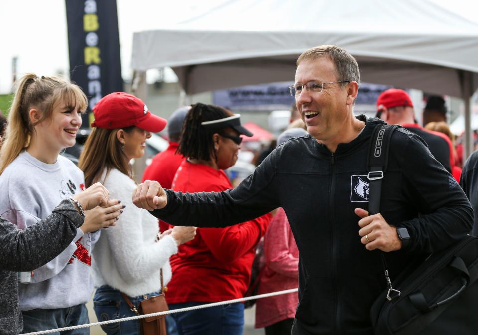 Louisville head football coach Scott Satterfield greet fans during the Cardmarch before the game against Boston College Saturday at Cardinal Stadium. Oct. 23, 2021