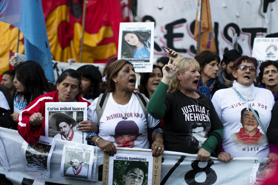 Demonstrators march against police brutality, in Buenos Aires, Argentina, Friday, May. 24, 2019. Argentines protested after officers on Monday fired shots that led to the deaths of three teenagers and a young man in a car chase. (AP Photo/Tomas F. Cuesta)