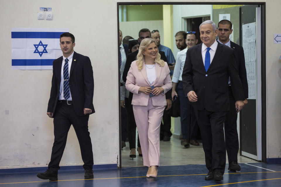 Israeli Prime Minister Benjamin and his wife Sarah arrive at a voting station in Jerusalem on September 17, 2019. Israelis began voting Tuesday in an unprecedented repeat election that will decide whether longtime Prime Minister Benjamin Netanyahu stays in power despite a looming indictment on corruption charges. (Heidi Levine, Sipa, Pool via AP).