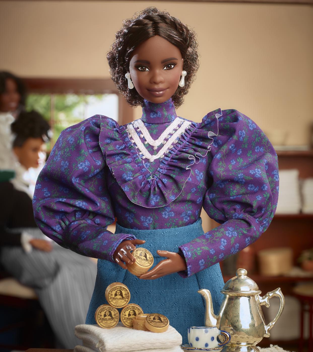 The Madam C.J. Walker Barbie even comes with a miniature version of her most popular hair product. (Photo: Mattel)
