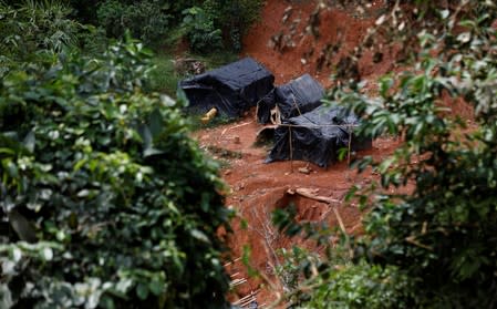 An informal settlement is seen next to a gold mine in Nsuaem district