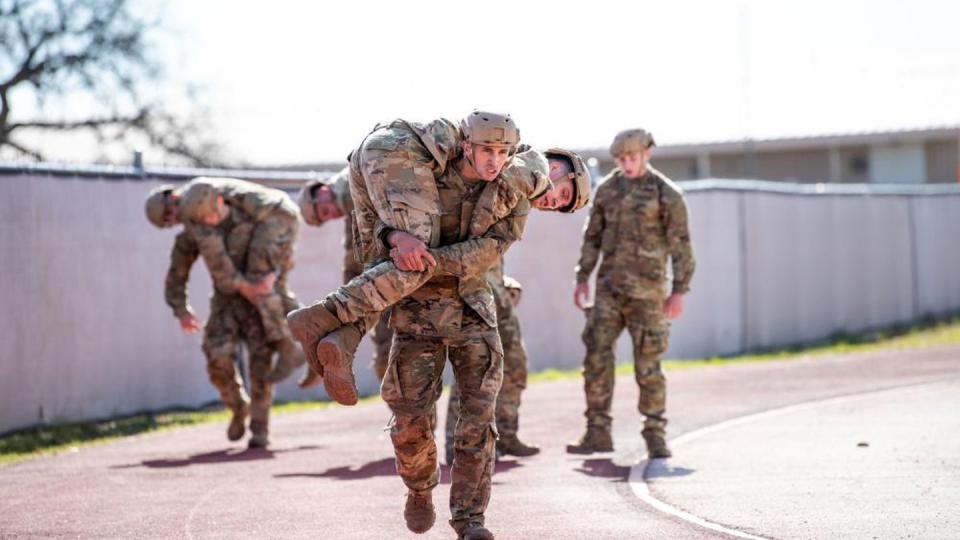 Special warfare candidates buddy-carry their teammates as part of 