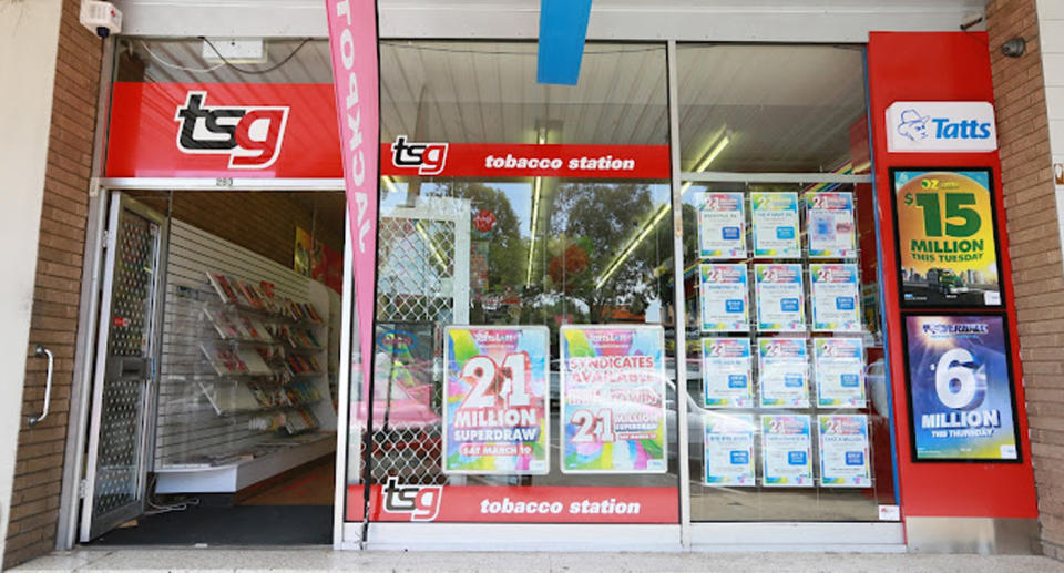 The outside of the newsagent can be seen with Lotto promo posters outside. 