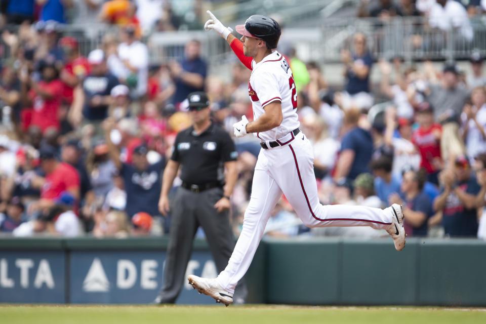 Atlanta Braves' Matt Olson gestures while running bases after hitting a two-run home run in the first inning of a baseball game against the Houston Astros, Sunday, Aug. 21, 2022, in Atlanta. (AP Photo/Hakim Wright Sr.)