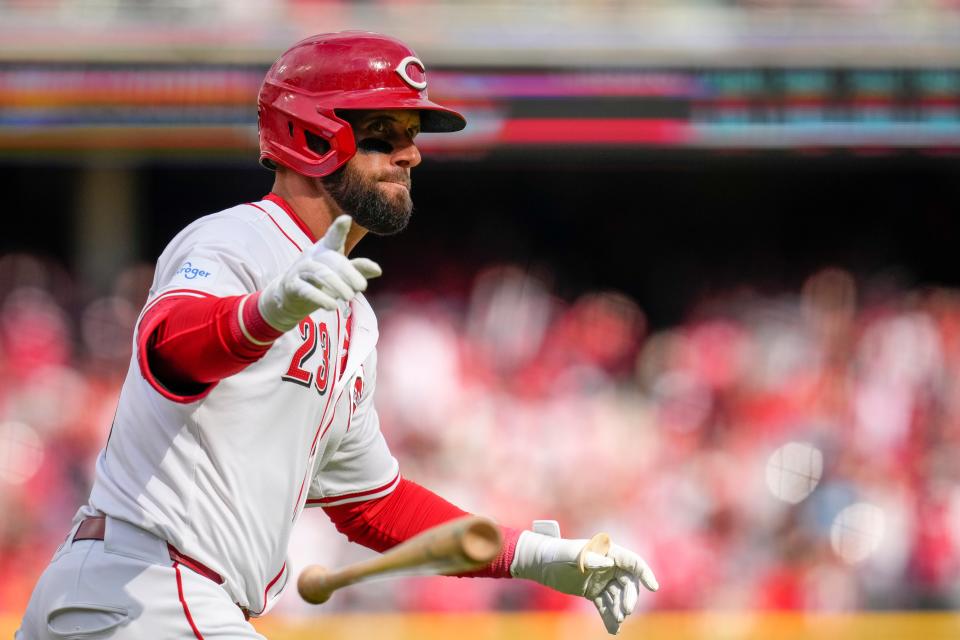 Nick Martini tosses his bat after connecting on his two-run home run in the second inning Thursday. The 33-year-old journeyman followed that with a three-run homer in the third inning, giving the Reds a 7-0 lead.