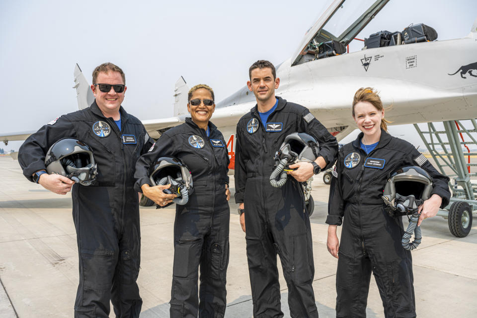 In this Aug. 8, 2021 photo provided by John Kraus, from left, Chris Sembroski, Sian Proctor, Jared Isaacman and Hayley Arceneaux stand for a photo in Bozeman, Mont., during a "fighter jet training" weekend to familiarize the crew with G-forces. (John Kraus/Inspiration4 via AP)