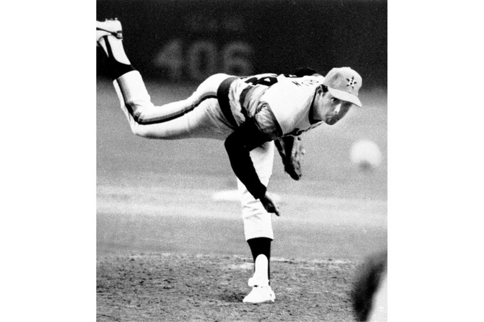 FILE - Houston Astros pitcher Nolan Ryan hurls the ball against the Los Angeles Dodgers, en route to the fifth no-hitter of his career, at the Houston Astrodome, Sept. 26, 1981. Hall of Fame pitcher Nolan Ryan is the subject of a new documentary. (AP Photo/Ed Kolenovsky, File)