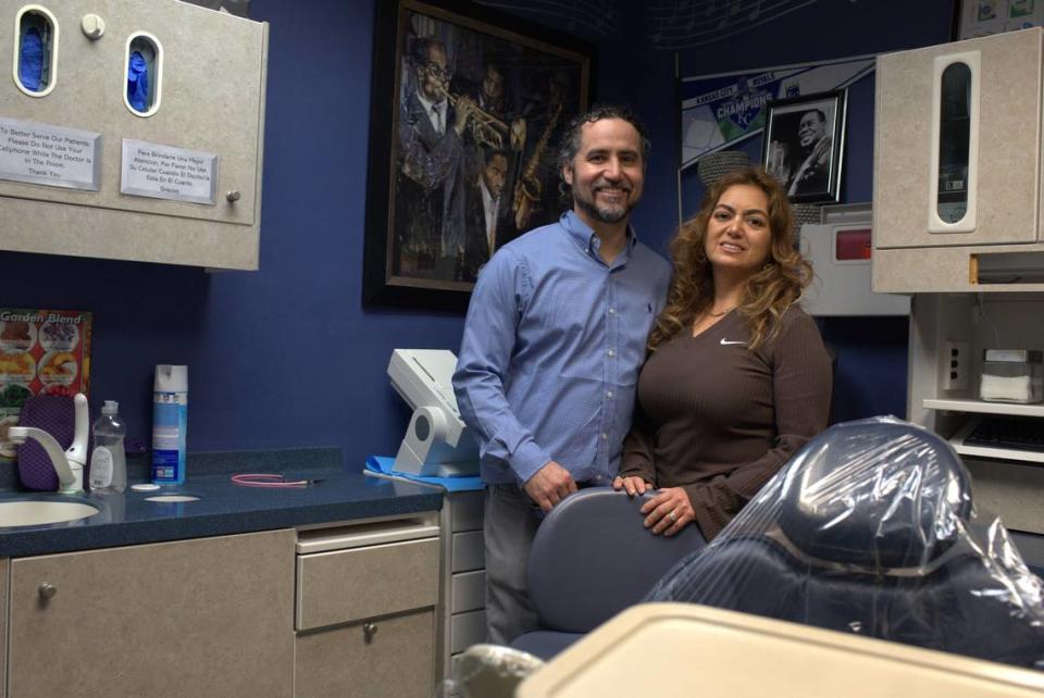 Dr. Miralda Moreno, of Moreno Family Dentistry, right, and her husband Eric Magnum, office manager, left, pose for a portrait inside one of the dental office’s examination rooms in the historic Brotherhood Building at 753 State Ave., Kansas City, Kansas.