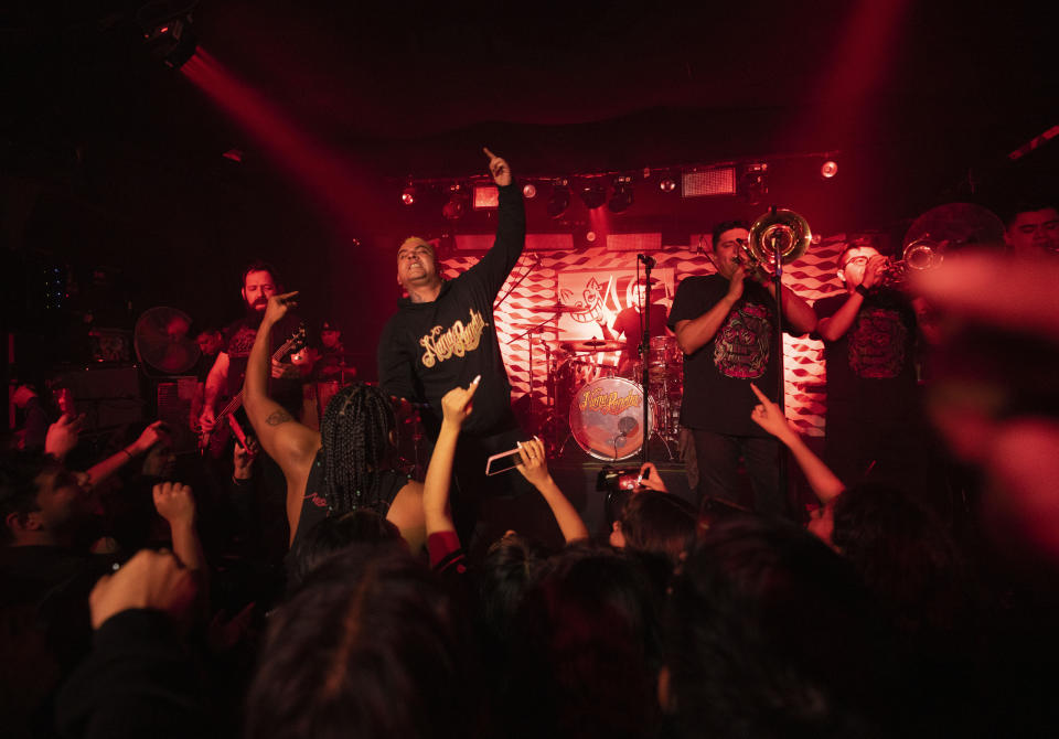 Abraham “Muñeko” Torres, the vocalist of the Mexican Ska band Nana Pancha, performs during one of the last active weekends at the iconic counterculture venue Multiforo Alicia in Mexico City, Friday, Feb. 10, 2023. "Muñeko” first played at the Alicia when he was 16-years-old. (AP Photo/Eduardo Verdugo)