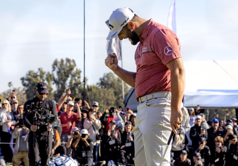 Jon Rahm pumps his fist after winning the Genesis Invitational on Sunday.