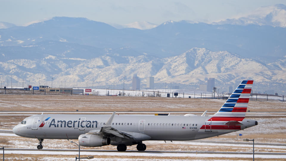 FILE - An American Airlines jetliner rumbles down a runway at Denver International Airport, Jan. 16, 2024, in Denver. American Airlines is lowering some of its second-quarter financial forecasts and has announced the departure of its chief commercial officer. (AP Photo/David Zalubowski, File)