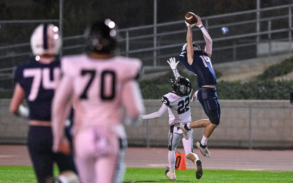 Central Valley Christian's Caden Ritchie intercepts a pass intended for Stockdale's Ben Spears in a Central Section Division II high school football playoff on Friday, November 3, 2023.