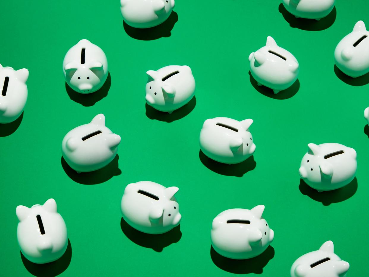 Piggy banks on a green background.