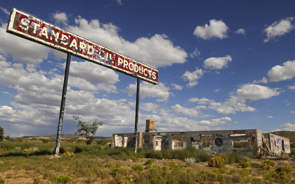 An abandoned Standard Oil gas station. Among other company breakups Standard Oil of California was named Chevron and Standard Oil of Indiana was named Amoco. John D. Rockefeller founded Standard Oil in 1870. | Location: Tonalea, Arizona, United States. (Photo by John van Hasselt/Corbis via Getty Images)