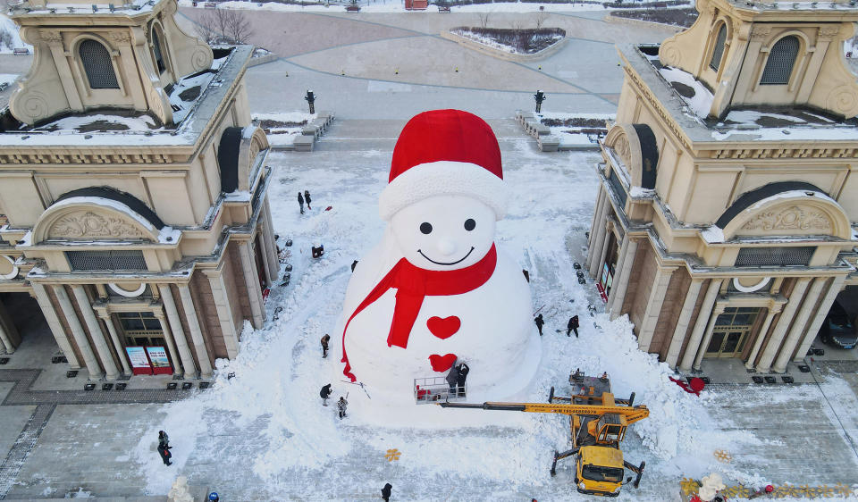 Aerial view of workers building an almost 60-foot tall snowman at Harbin Music Park ahead of Lunar New Year, the Year of the Rabbit, on Jan. 4, 2023, in Harbin, Heilongjiang Province of China.