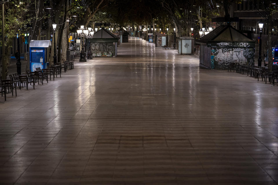 Las Ramblas of Barcelona are pictured after curfew on Sunday, Oct. 25, 2020. Spain orders nationwide curfew to stem worsening outbreak. Spanish Prime Minister Pedro Sánchez has declared a second nationwide state of emergency in hopes of stemming a resurgence in coronavirus infections. (AP Photo/Emilio Morenatti)