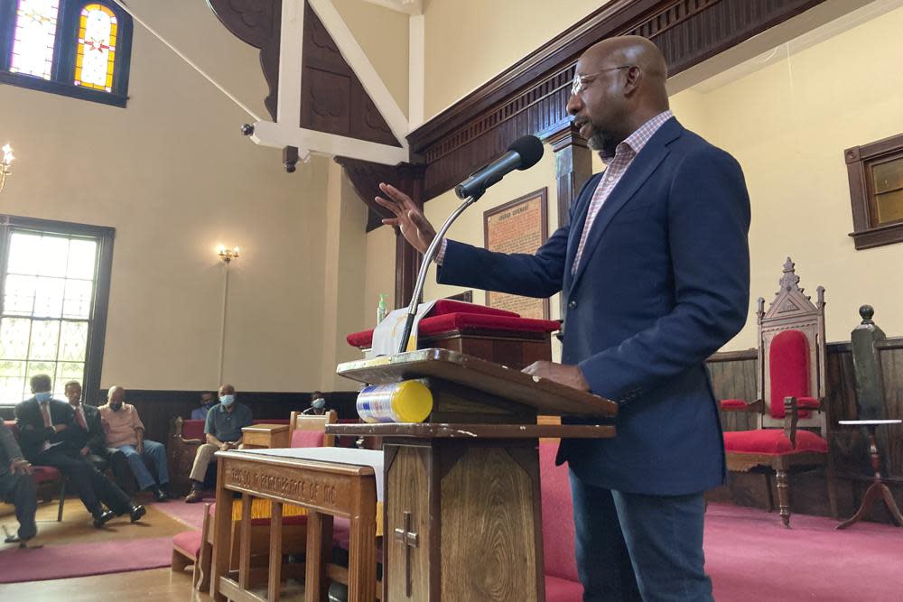 Sen. Raphael Warnock, D-Ga., who is the pastor of Ebenezer Baptist Church in Atlanta, campaigns at a church by the same name in Eatonton, Ga., on Aug. 18, 2022. (AP Photo/Bill Barrow)