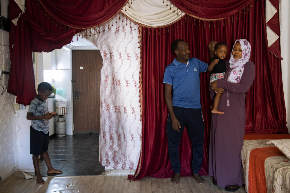 Musa Family, Sudanese migrant pose for a photo at their house in south Tel Aviv, Israel, Friday, Oct. 30, 2020. After Israel and Sudan agreed this month to normalize ties, some 6,000 Sudanese migrants in Israel are again fearing for their fate. Israel has long grappled with how to deal with its tens of thousands of African migrants. (AP Photo/Oded Balilty)