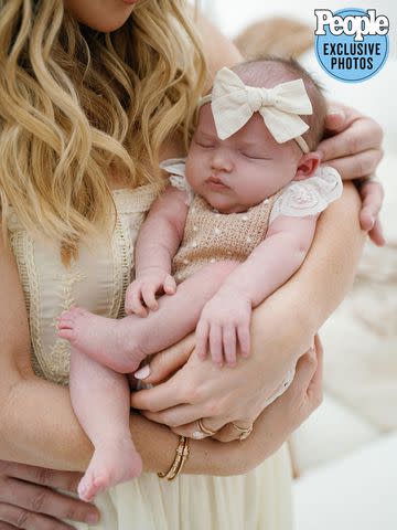 <p>Jenny Quicksall Photography</p> Tara Lipinski and baby Georgie