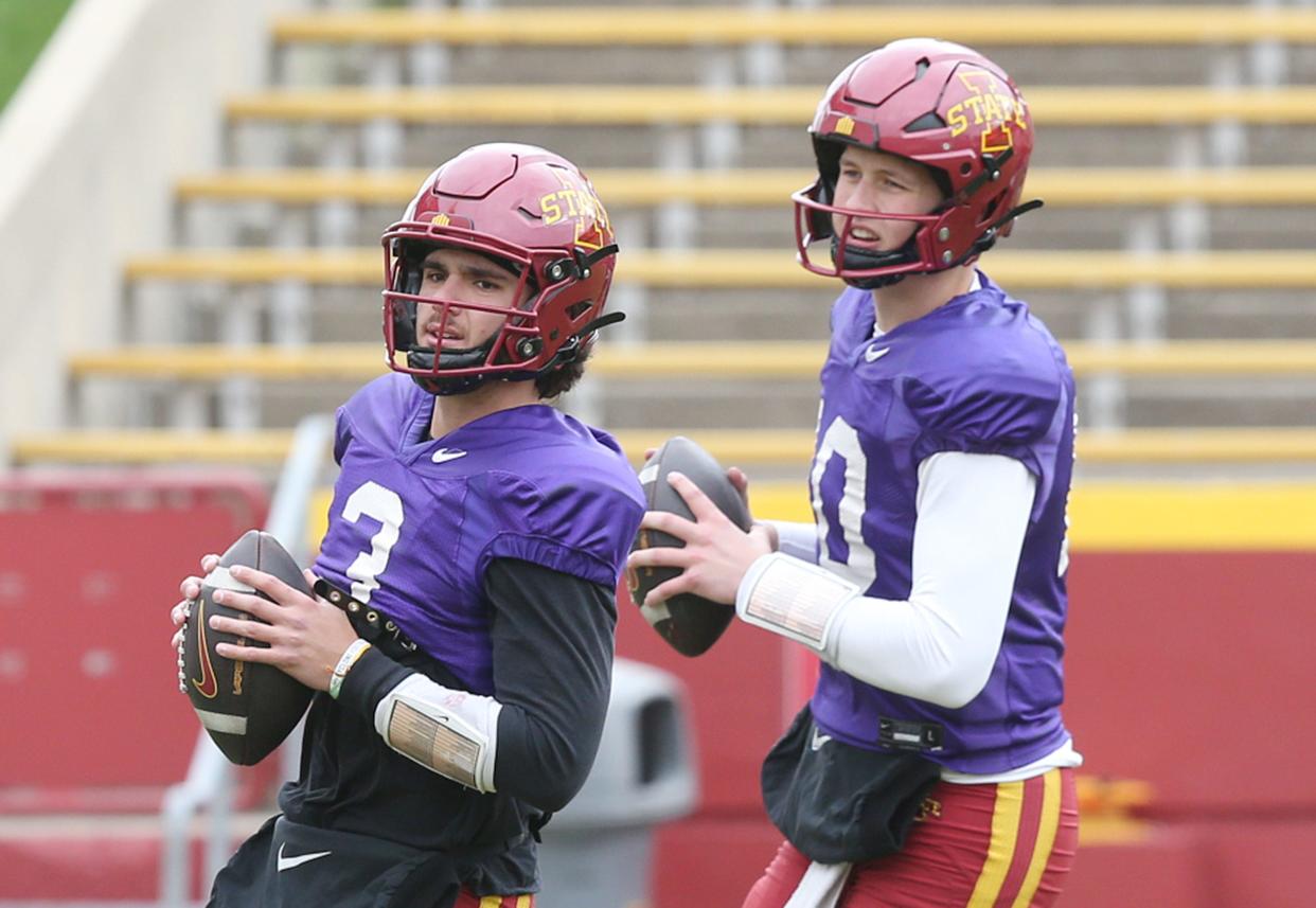 Iowa State quarterbacks Rocco Becht (left) and J.J. Kohl warm up before Saturday's final spring football practice.