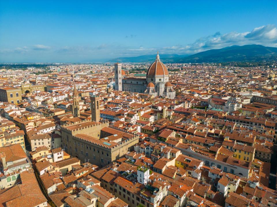 close aerial perspective of florence cathedral, cattedrale di santa maria del fiore, on a sunlit day in florence, italy