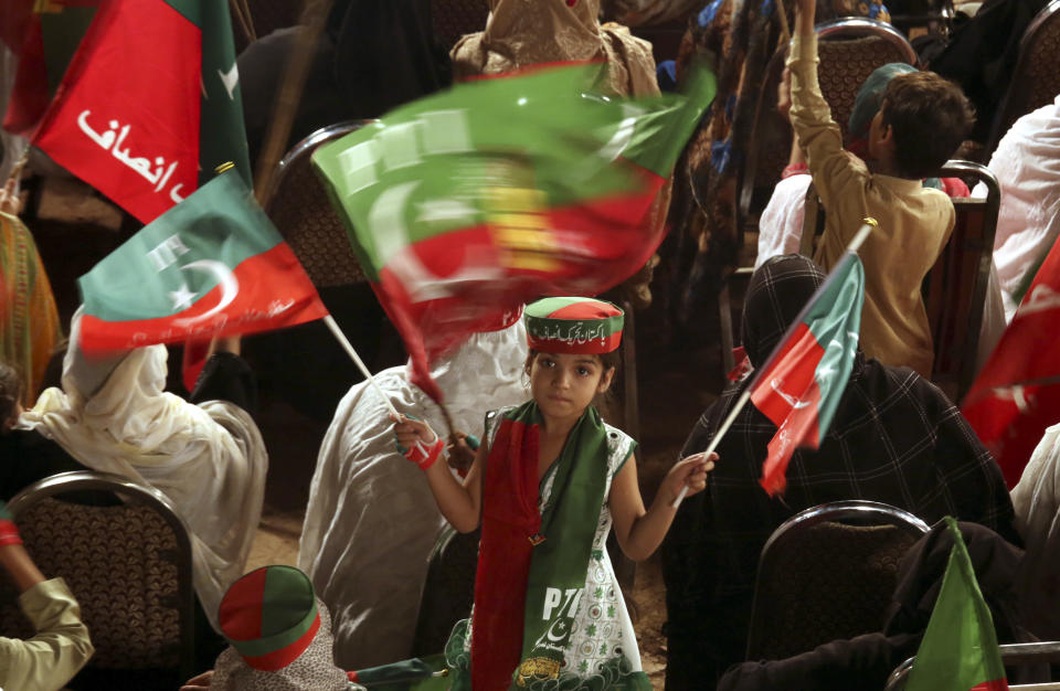 Supporters of Pakistani opposition leader Imran Khan's Tehreek-e-Insaf party attend a rally, in Peshawar, Pakistan, Tuesday, Sept. 6, 2022. Since he was toppled by parliament five months ago, former Prime Minister Imran Khan has demonstrated his popularity with rallies that have drawn huge crowds and signaled to his rivals that he remains a considerable political force. (AP Photo/Mohammad Sajjad)