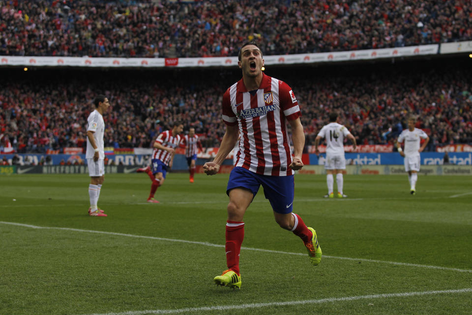 Atletico's Koke celebrates his goal during a Spanish La Liga soccer match between Atletico de Madrid and Real Madrid at the Vicente Calderon stadium in Madrid, Spain, Sunday, March 2, 2014. (AP Photo/Gabriel Pecot)