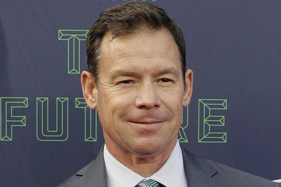 FILE - Jim Mora poses for photos on the red carpet before the first round of the 2018 NFL football draft in Arlington, Texas on April 26, 2018. On Thursday, Nov. 11, 2021, UConn hired former UCLA coach Jim Mora, who also coached two NFL teams, to lead the Huskies. Mora has been out of coaching and has been working as a television analyst after spending six seasons (2012-17) leading UCLA to a 46-30 record. (AP Photo/Eric Gay, File)