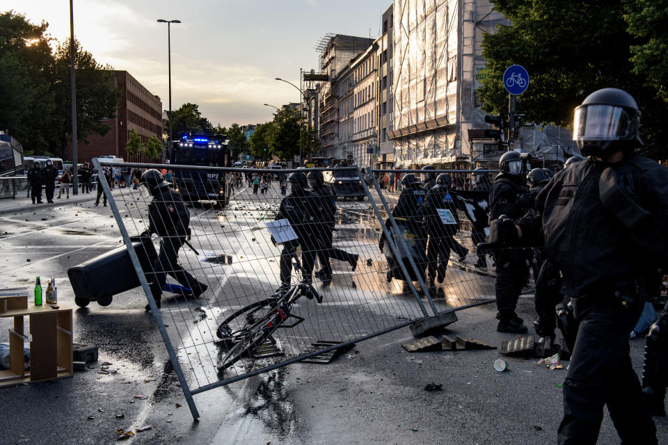 Police put a crush barrier away.&nbsp;