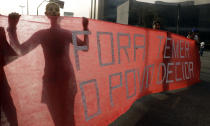 <p>Demonstrators hold a banner — “Temer out, the people decide” — during a protest against Brazil’s acting President Michel Temer, in São Paulo, Aug. 30, 2016. (Photo: AP/Andre Penner) </p>