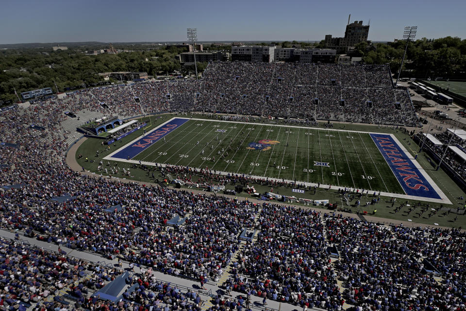 Fans watch during the second half of an NCAA college football game between Kansas and Duke Saturday, Sept. 24, 2022, in Lawrence, Kan. Kansas won 35-27. (AP Photo/Charlie Riedel)